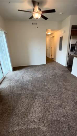 Wall-to-wall tan carpet in an open living space